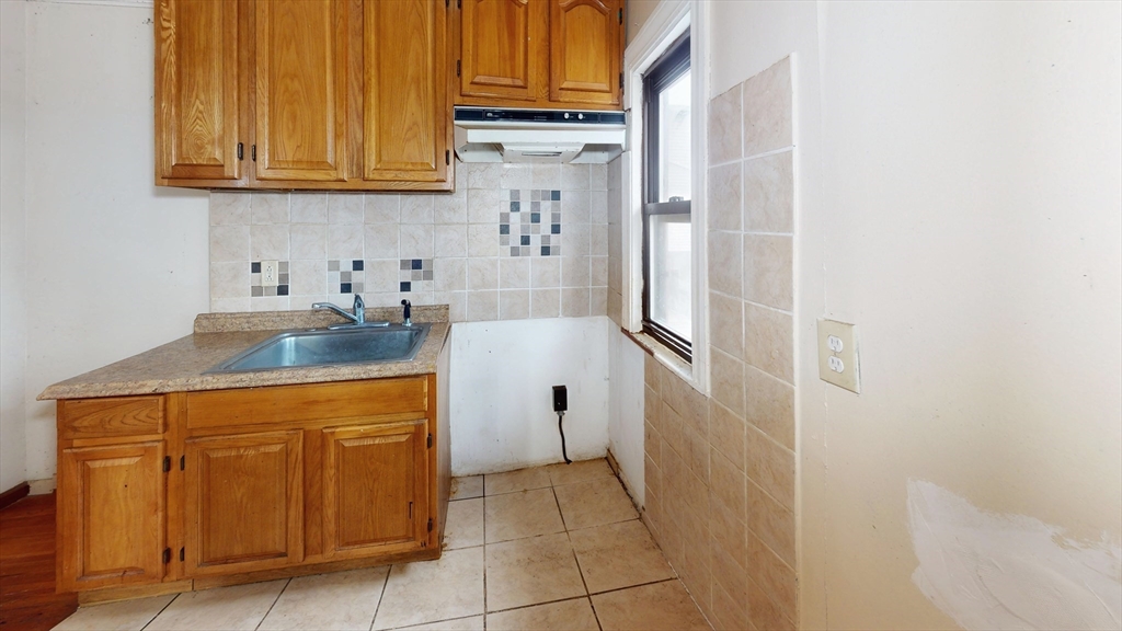 1403 Worcester Street Springfield, MA 01151 - Photo 8 of 23 a kitchen with stainless steel appliances granite countertop a refrigerator and a stove