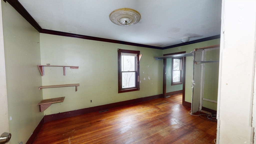 1403 Worcester Street Springfield, MA 01151 - Photo 9 of 23 a view of a room with wooden floor and window