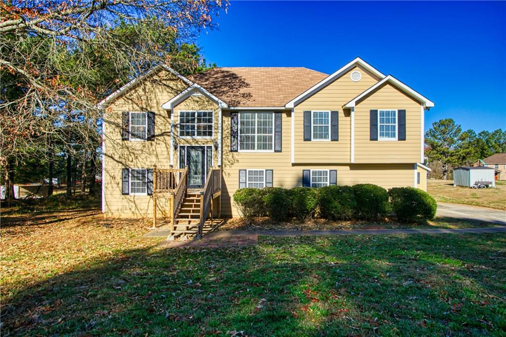 4072 Peachtree Farms Road Rex, GA 30273 - Photo 1 of 1 a front view of a house with a yard