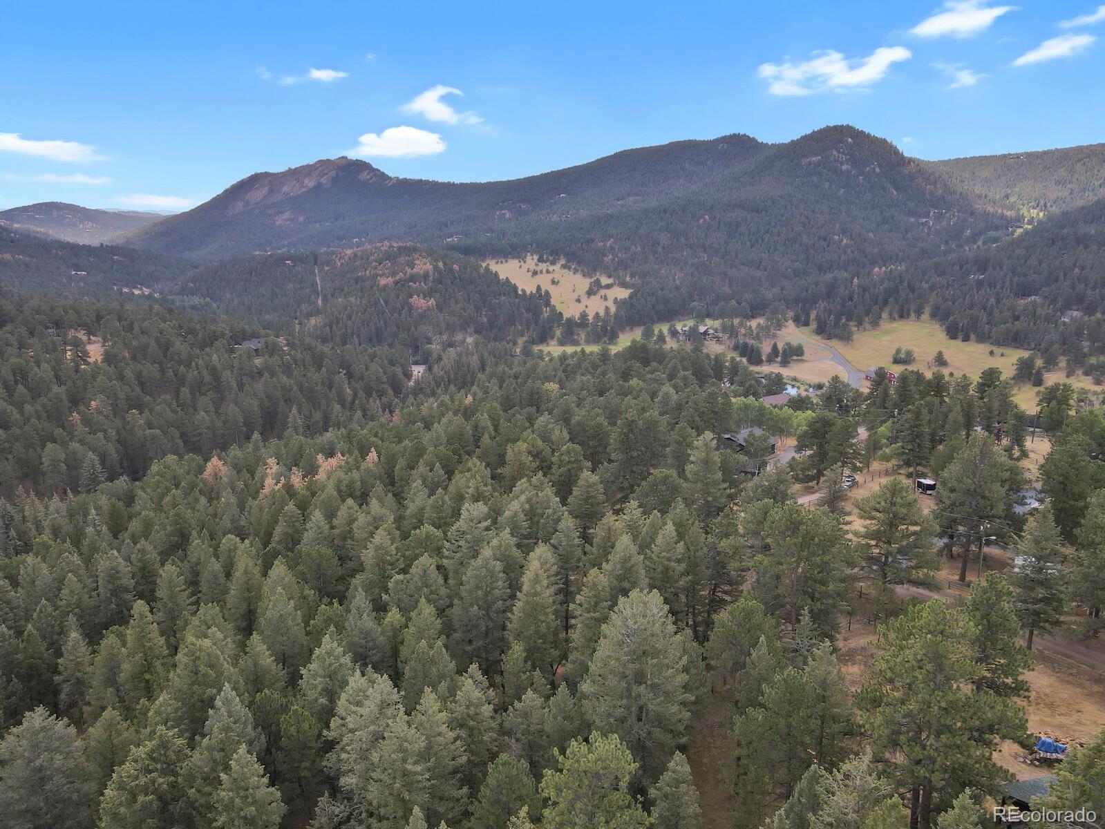 281 Kings Road Evergreen, CO 80439 - Photo 6 of 17 a view of a mountains in the distance