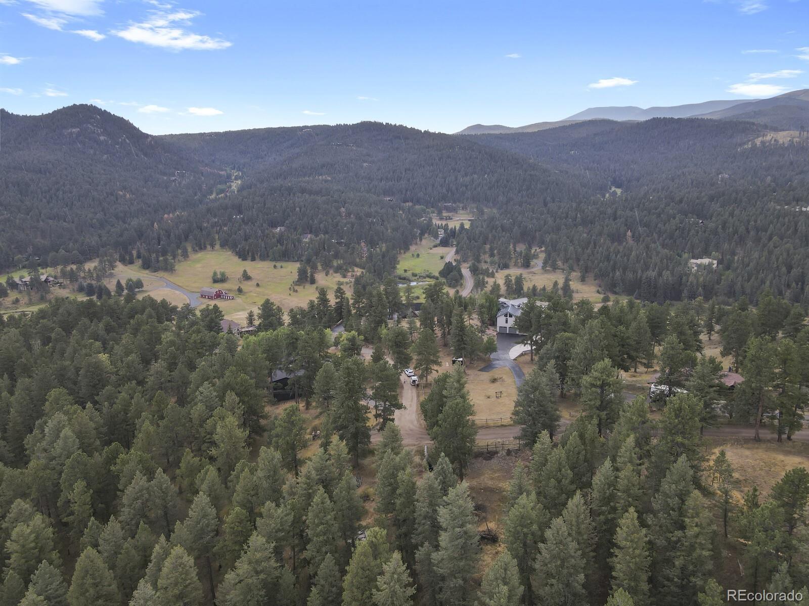 281 Kings Road Evergreen, CO 80439 - Photo 7 of 17 a view of a house with a mountain