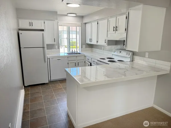 a view of a hardwood floor in a room