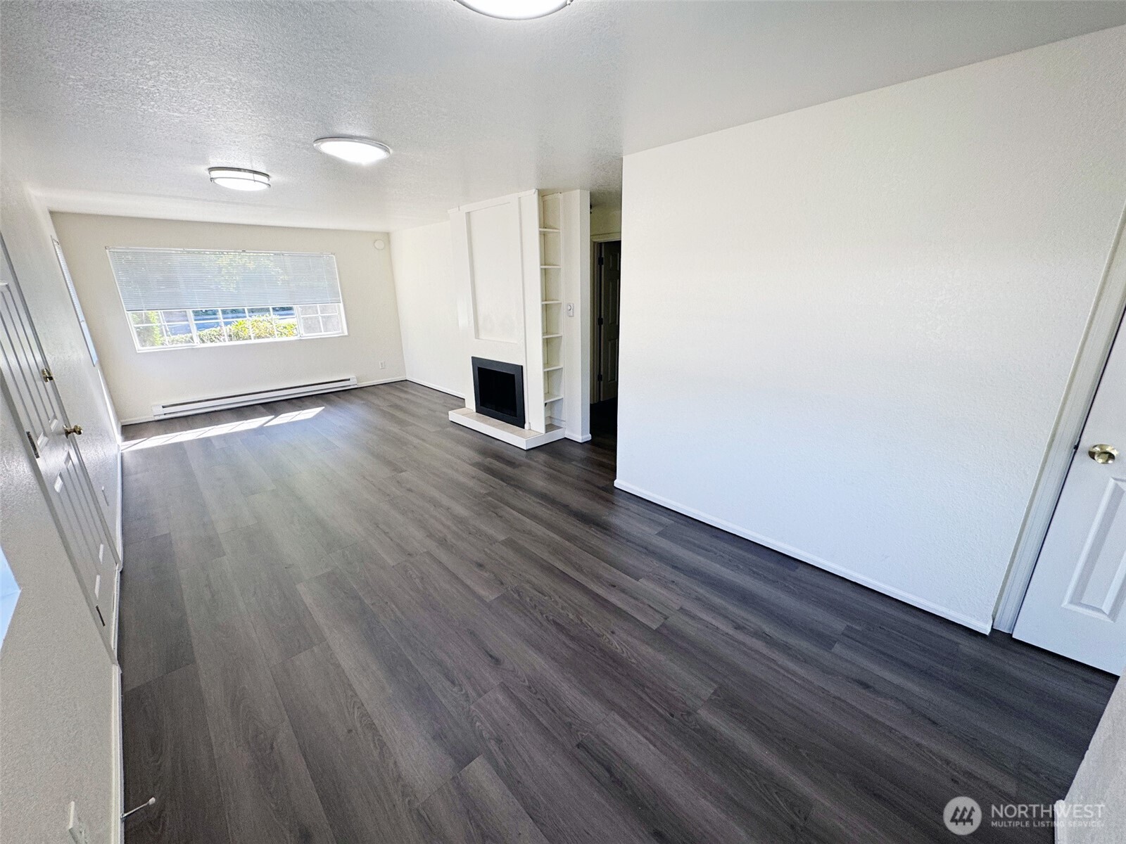 820 32nd Street Bellingham, WA 98225 - Photo 28 of 39 a view of an empty room with wooden floor and a window