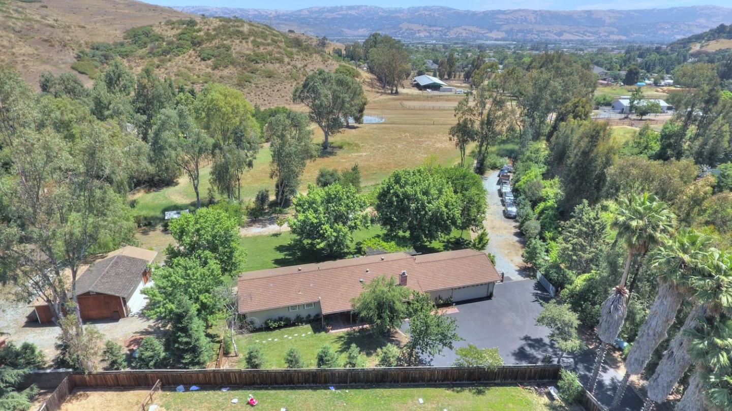 an aerial view of a house with yard