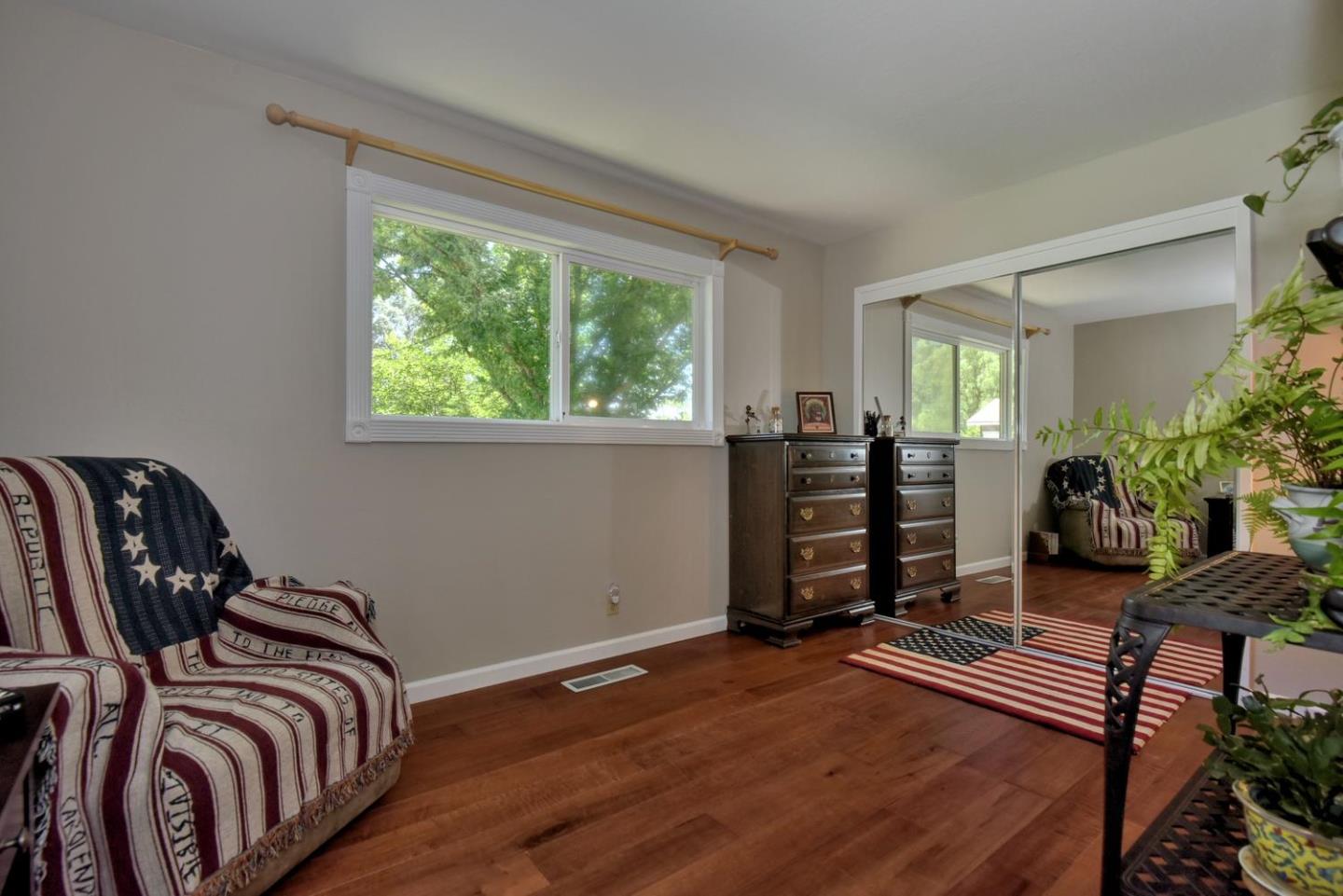 1175 Llagas Road Morgan Hill, CA 95037 - Photo 20 of 37 a bedroom with a bed and a chair
