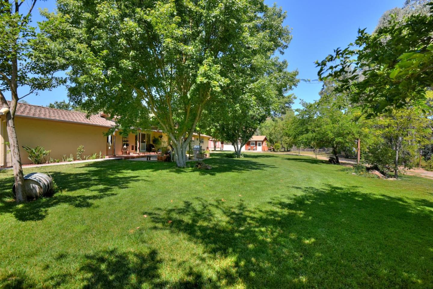 1175 Llagas Road Morgan Hill, CA 95037 - Photo 26 of 37 a view of a backyard with a garden