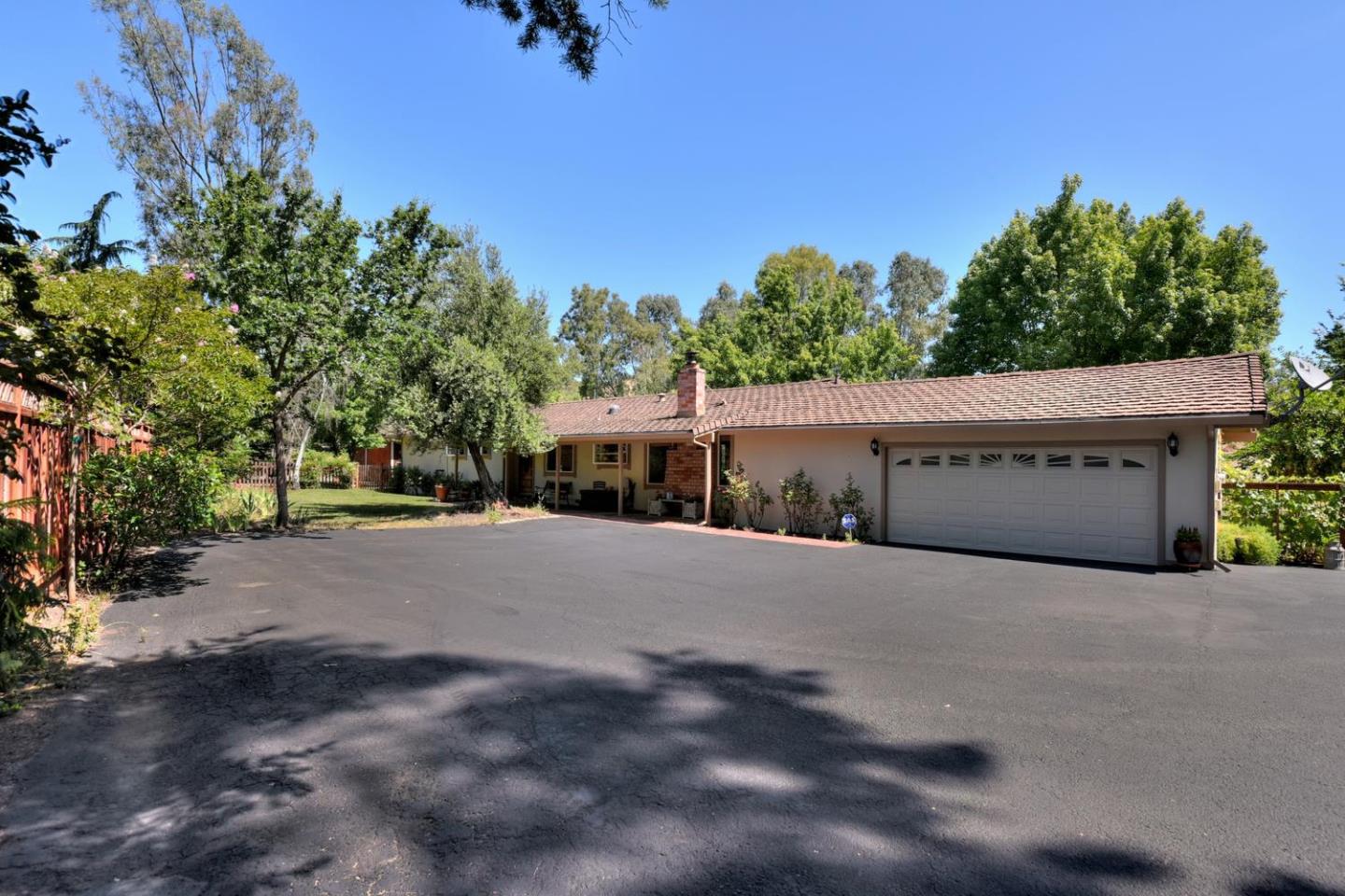 1175 Llagas Road Morgan Hill, CA 95037 - Photo 7 of 37 a house with trees in the background