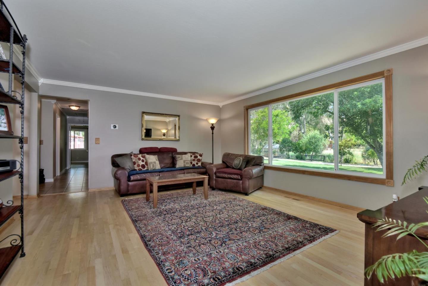 1175 Llagas Road Morgan Hill, CA 95037 - Photo 8 of 37 a living room with furniture and a rug