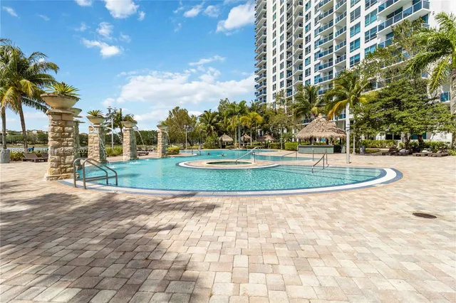 a view of a swimming pool with a table and chairs
