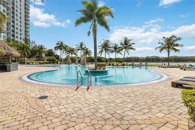 a view of a backyard with plants and patio