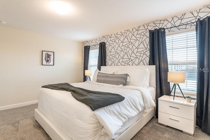 5025 Windermere Avenue Kissimmee, FL 34746 - Photo 13 of 33 a bedroom with a bed and a window