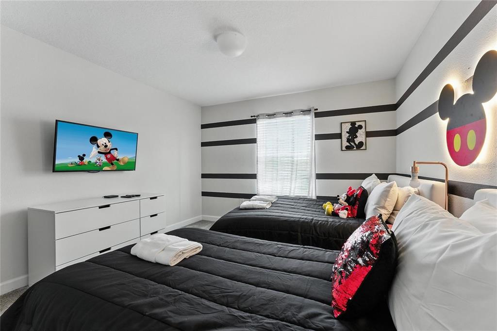 5025 Windermere Avenue Kissimmee, FL 34746 - Photo 18 of 33 a bedroom with a bed and dresser