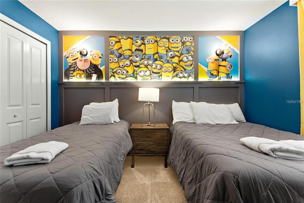 5025 Windermere Avenue Kissimmee, FL 34746 - Photo 20 of 33 a bedroom with a bed and cupboard