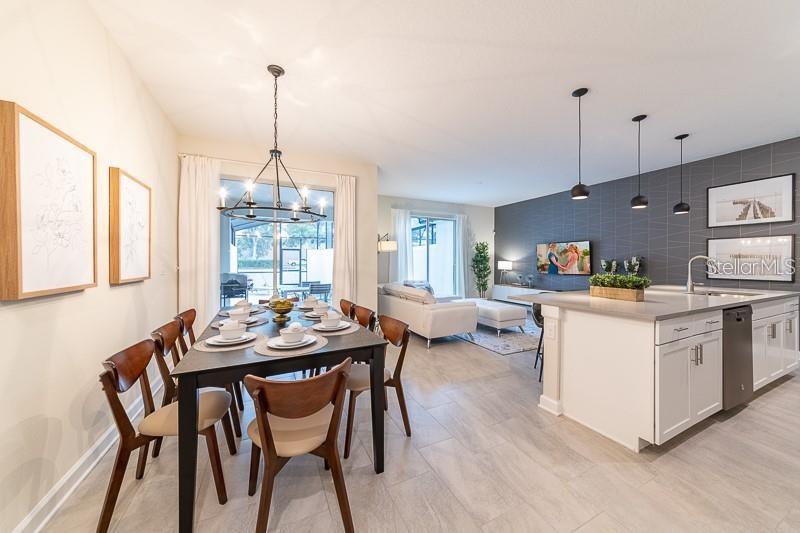 5025 Windermere Avenue Kissimmee, FL 34746 - Photo 2 of 33 a kitchen that has a table and chairs in it