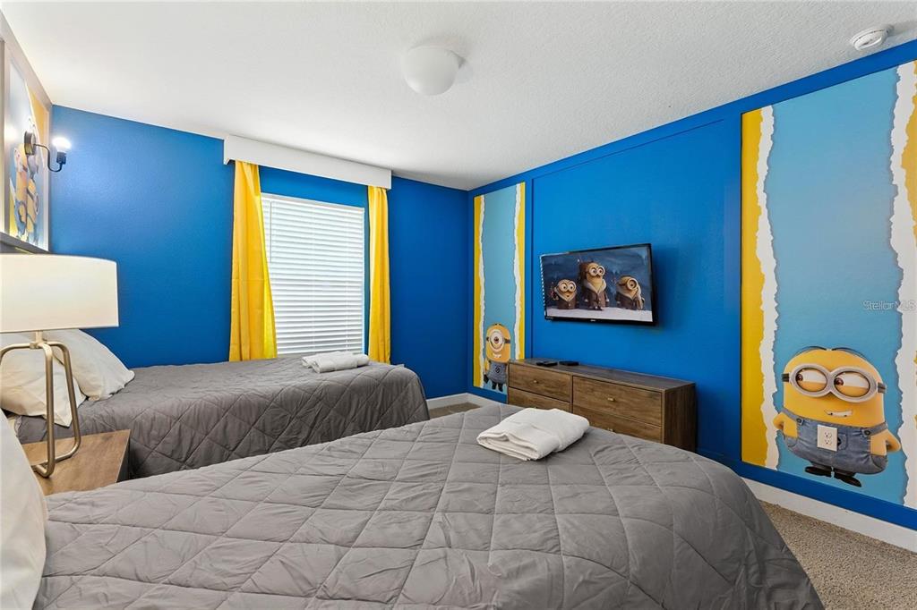 5025 Windermere Avenue Kissimmee, FL 34746 - Photo 21 of 33 a bedroom with double bed and a window