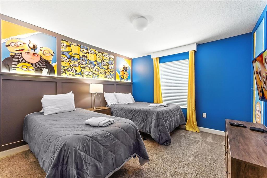 5025 Windermere Avenue Kissimmee, FL 34746 - Photo 22 of 33 a bedroom with two beds and painting on the wall