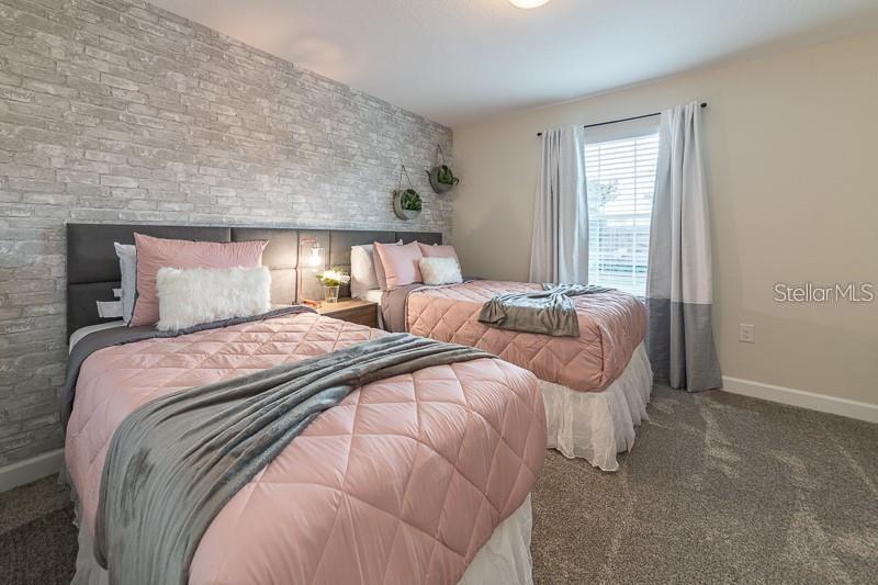 5025 Windermere Avenue Kissimmee, FL 34746 - Photo 26 of 33 a bedroom with a bed and a large window