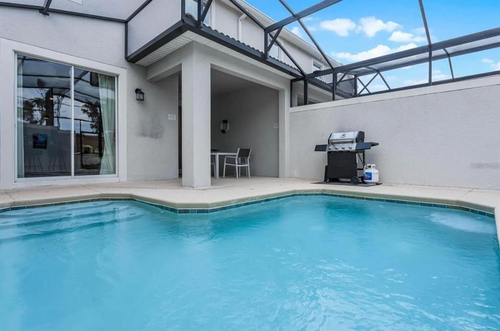 5025 Windermere Avenue Kissimmee, FL 34746 - Photo 29 of 33 a view of swimming pool with outdoor seating