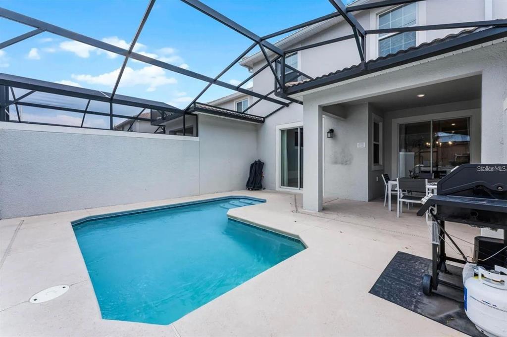 5025 Windermere Avenue Kissimmee, FL 34746 - Photo 30 of 33 a view of a room with gym equipment