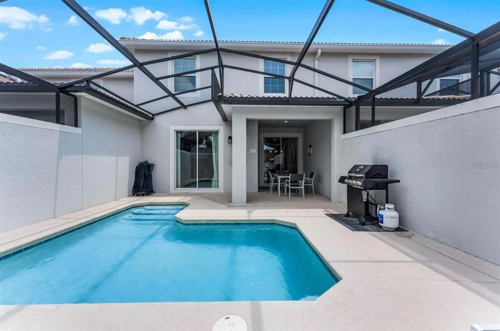 5025 Windermere Avenue Kissimmee, FL 34746 - Photo 31 of 33 a view of swimming pool with seating area