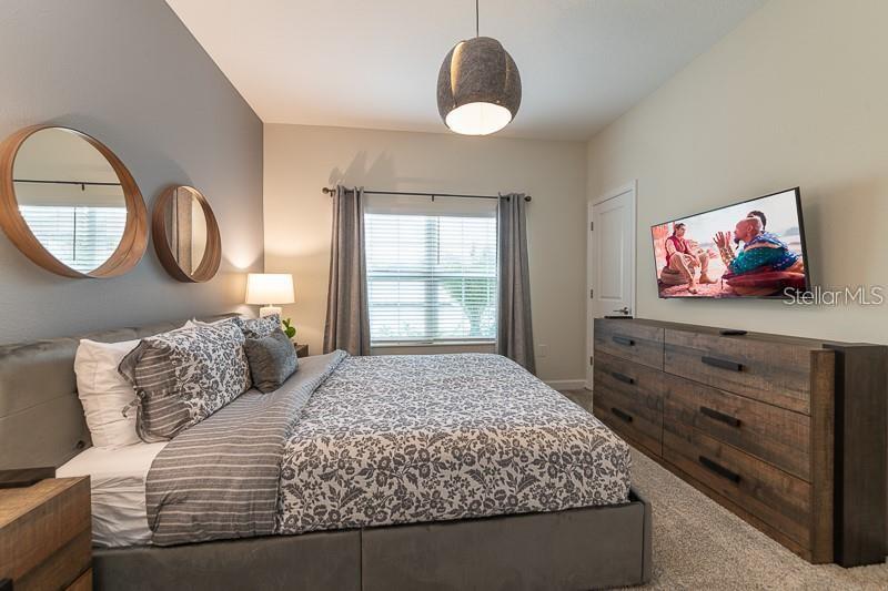 5025 Windermere Avenue Kissimmee, FL 34746 - Photo 10 of 33 a bedroom with a bed and a window