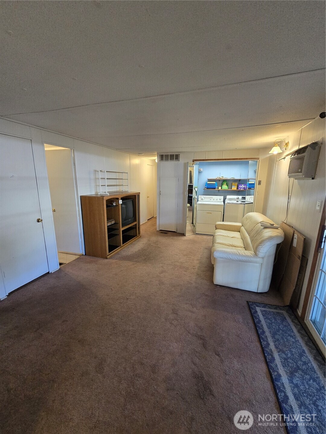2302 R Street Southeast, Unit 115 Auburn, WA 98002 - Photo 13 of 33 a living room with furniture and a fireplace