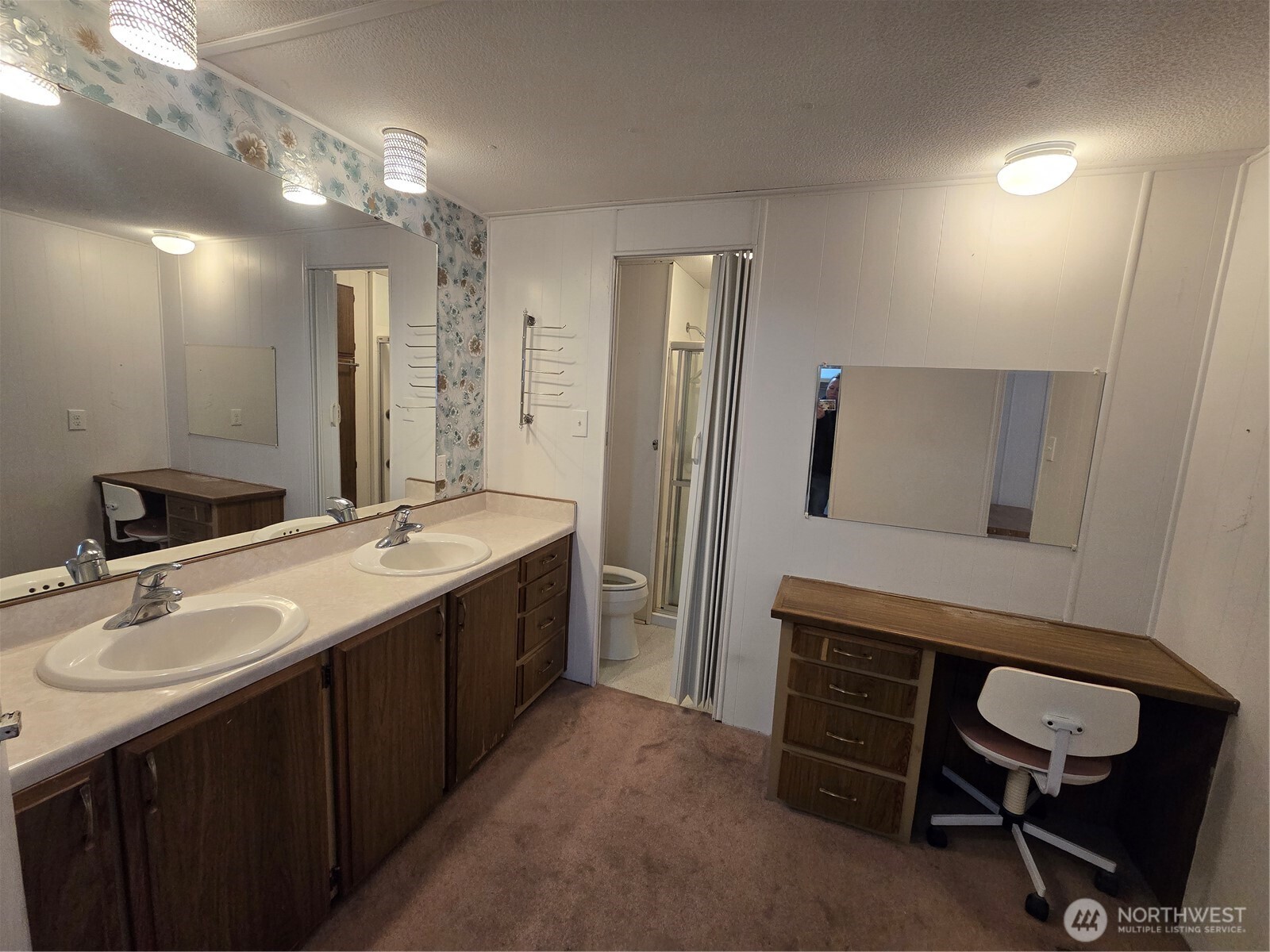 2302 R Street Southeast, Unit 115 Auburn, WA 98002 - Photo 17 of 33 a bathroom with a double vanity sink a toilet a and mirror