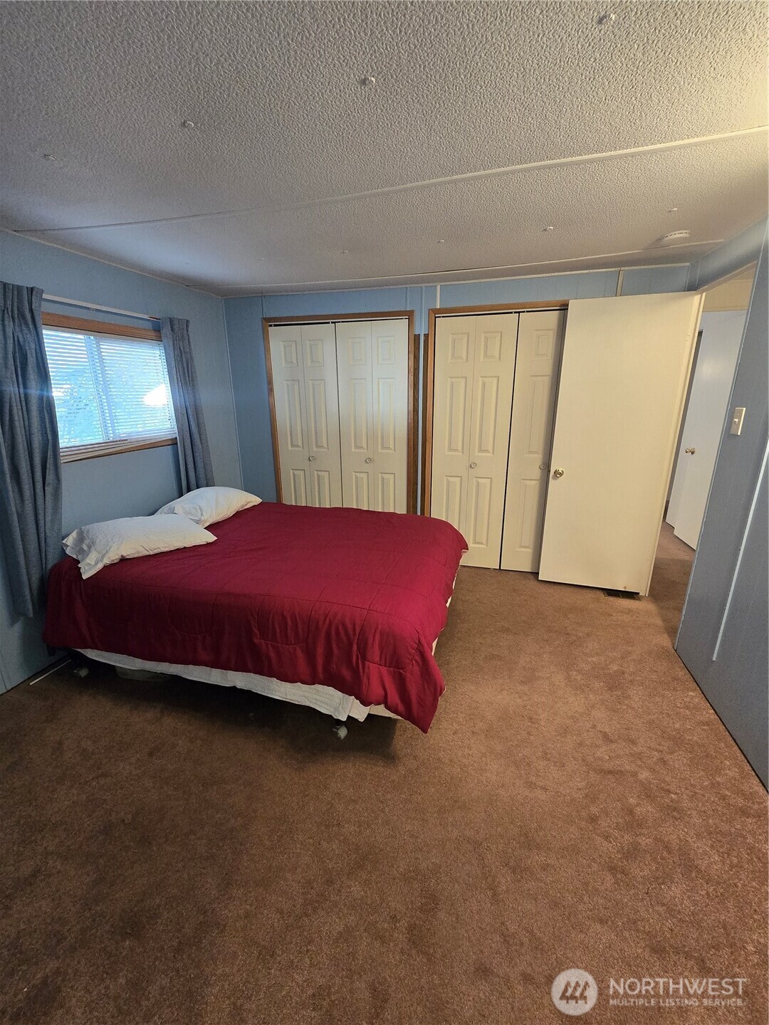 2302 R Street Southeast, Unit 115 Auburn, WA 98002 - Photo 20 of 33 a bedroom with a bed and a window