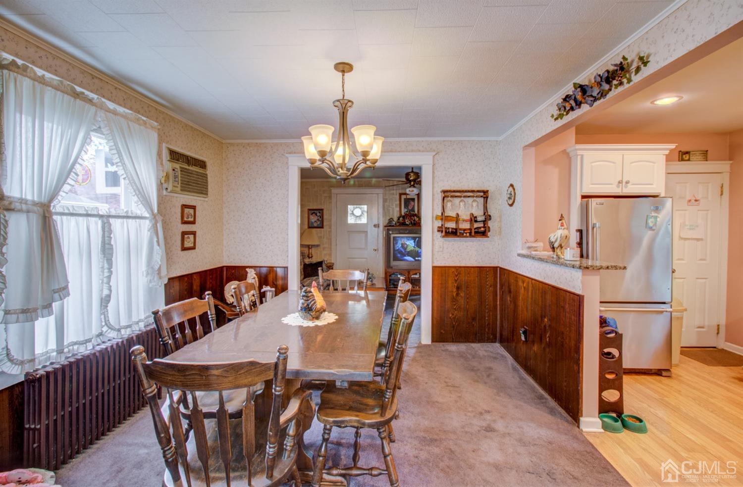 3 Division Street Metuchen, NJ 08840 - Photo 12 of 20 a dining room with furniture a chandelier and wooden floor