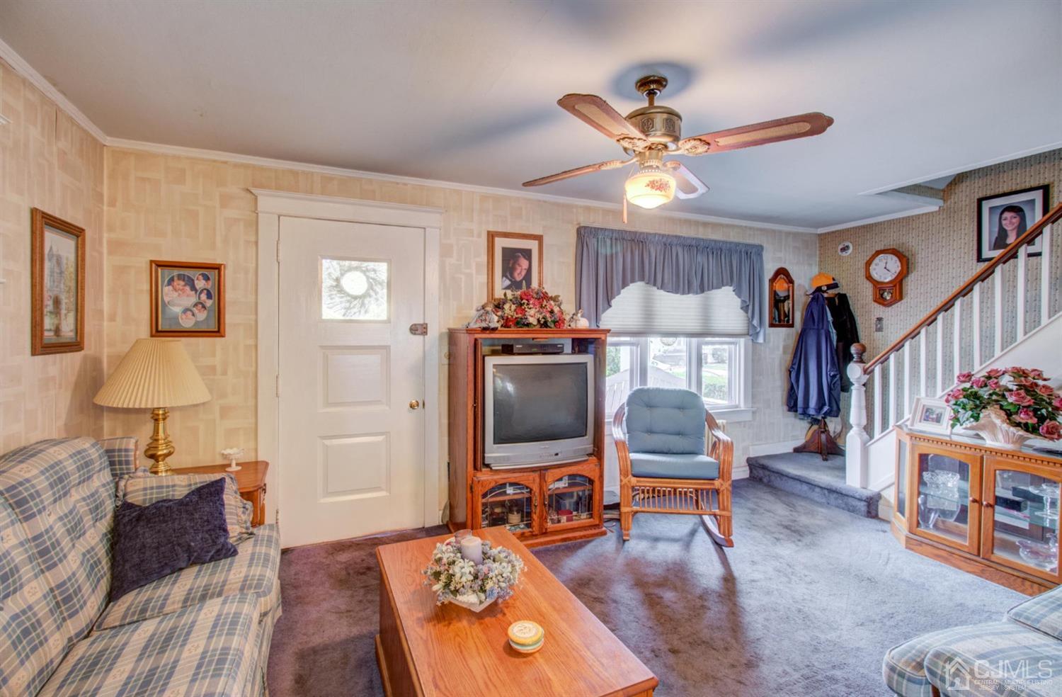 3 Division Street Metuchen, NJ 08840 - Photo 3 of 20 a living room with furniture and a wooden floor