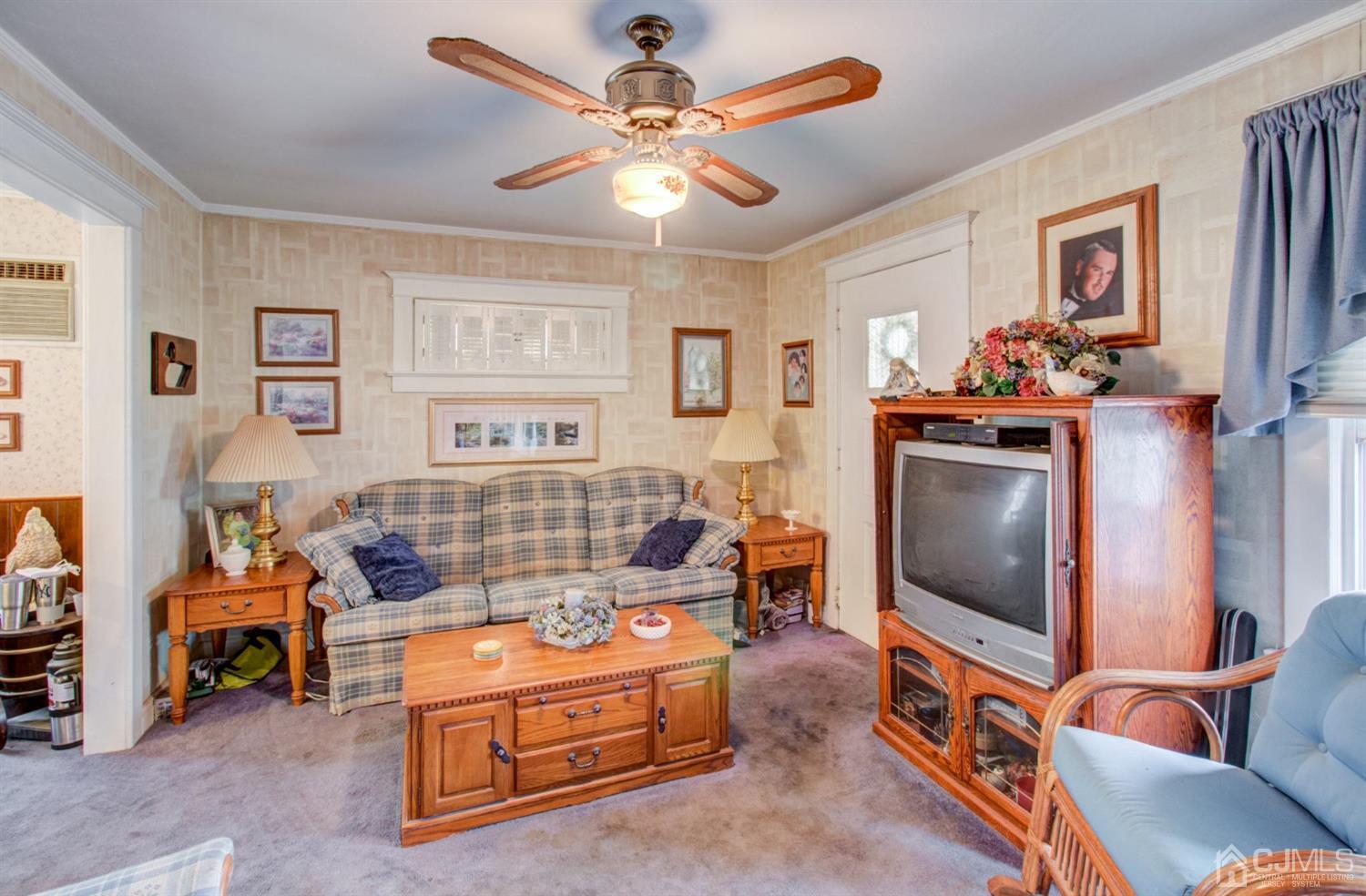 3 Division Street Metuchen, NJ 08840 - Photo 4 of 20 a living room with furniture and a flat screen tv