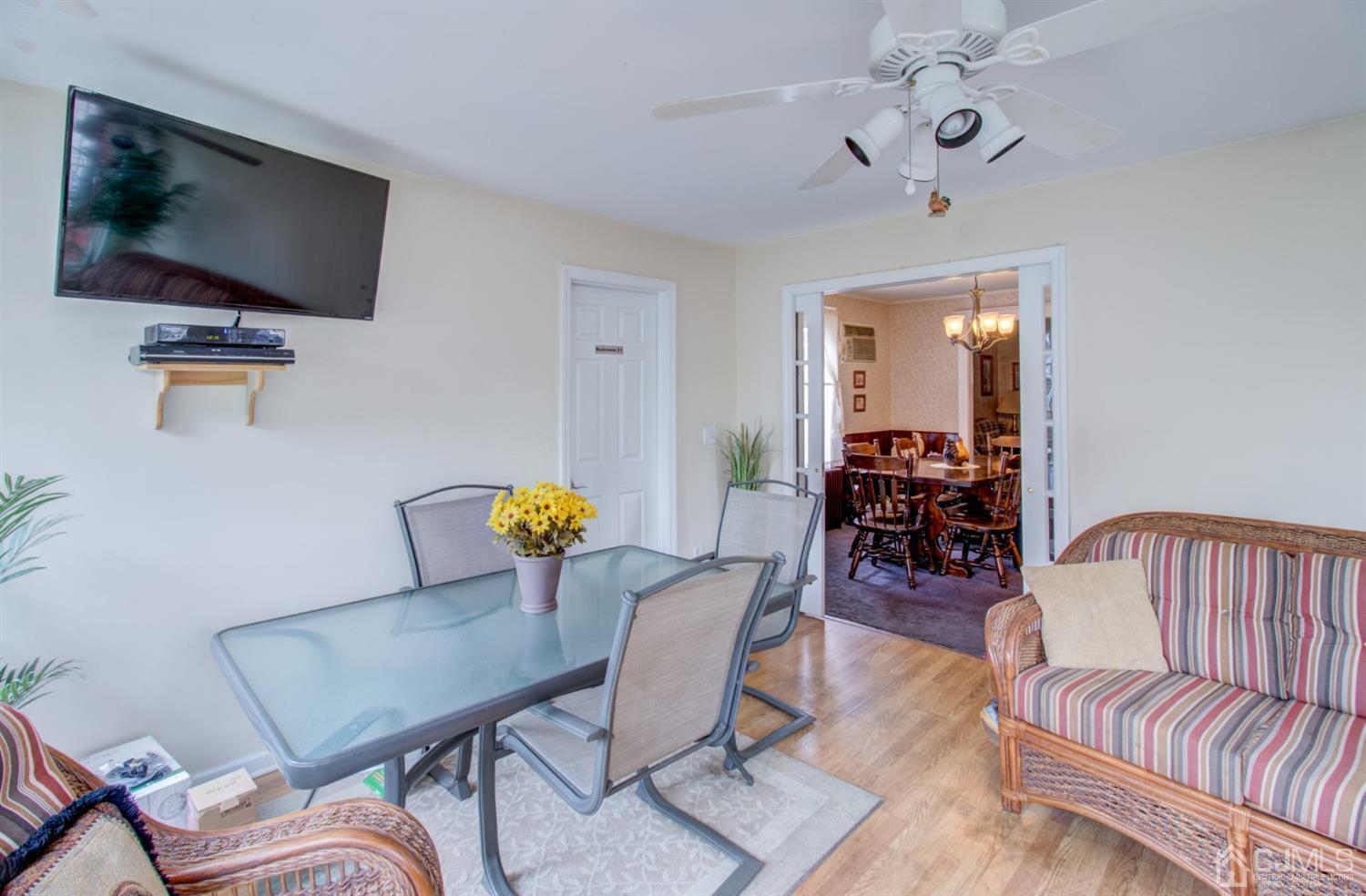 3 Division Street Metuchen, NJ 08840 - Photo 7 of 20 a view of a livingroom with furniture and a flat screen tv