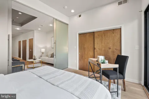 a bedroom with a bed and furniture
