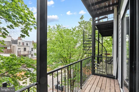 a view of a balcony with plants