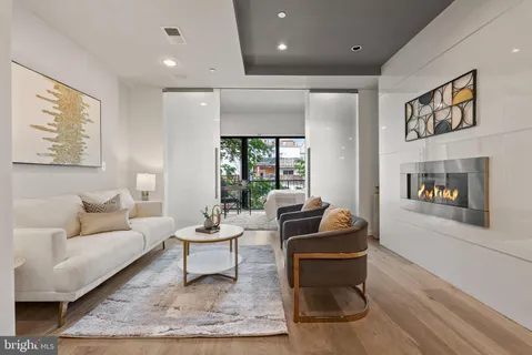a living room with furniture and a rug