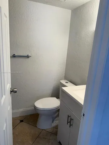 a bathroom with a toilet and a sink