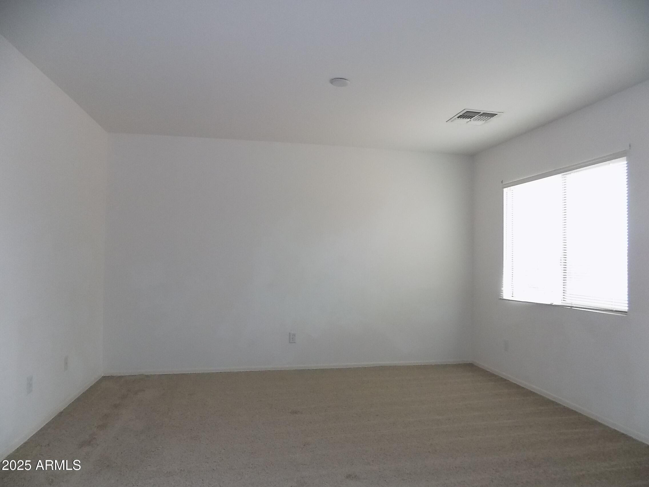 5423 West Shumway Farm Road Laveen, AZ 85339 - Photo 12 of 21 an empty room with a window
