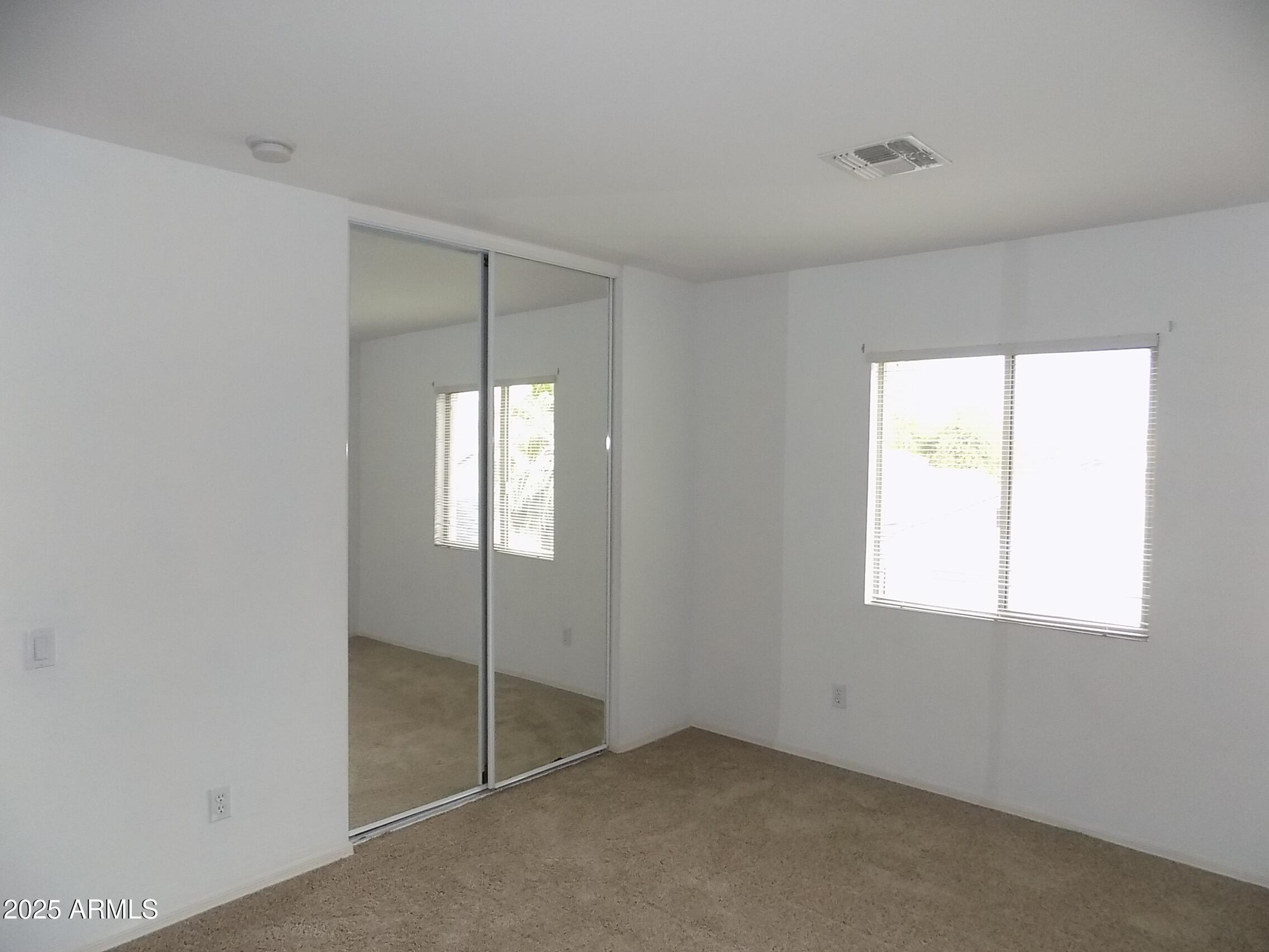 5423 West Shumway Farm Road Laveen, AZ 85339 - Photo 14 of 21 a view of an empty room with a window