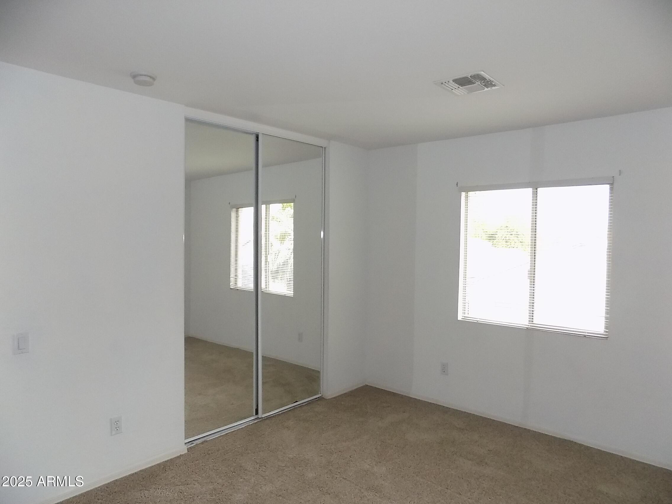 5423 West Shumway Farm Road Laveen, AZ 85339 - Photo 14 of 21 en empty room with window