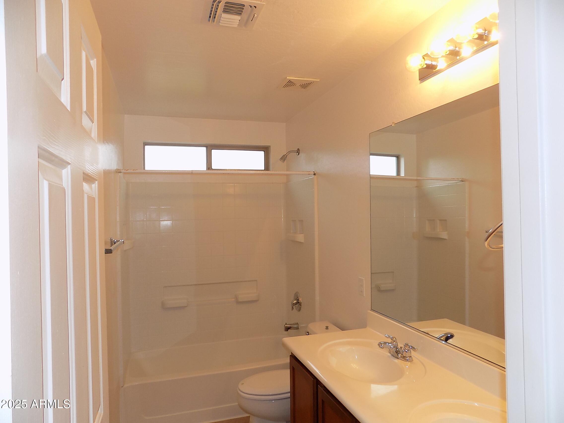 5423 West Shumway Farm Road Laveen, AZ 85339 - Photo 15 of 21 a bathroom with a sink toilet and shower