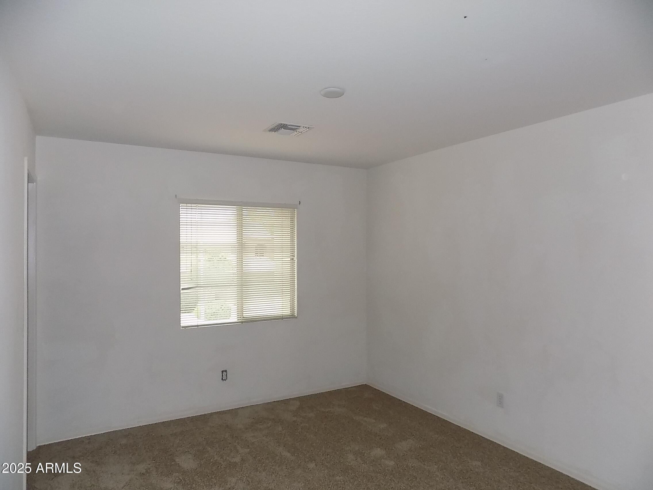 5423 West Shumway Farm Road Laveen, AZ 85339 - Photo 18 of 21 an empty room with a window