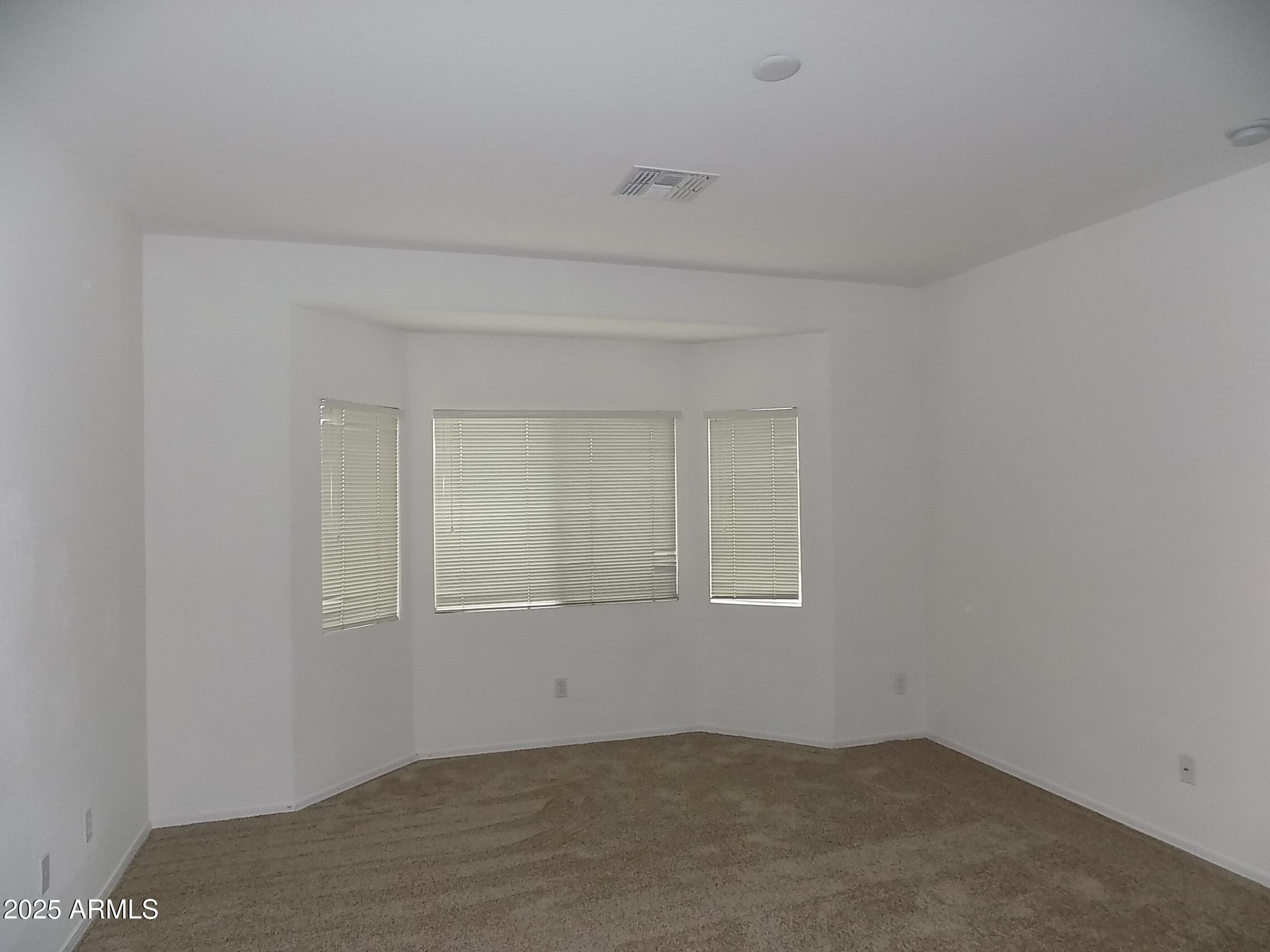5423 West Shumway Farm Road Laveen, AZ 85339 - Photo 10 of 21 an empty room with a empty space and window