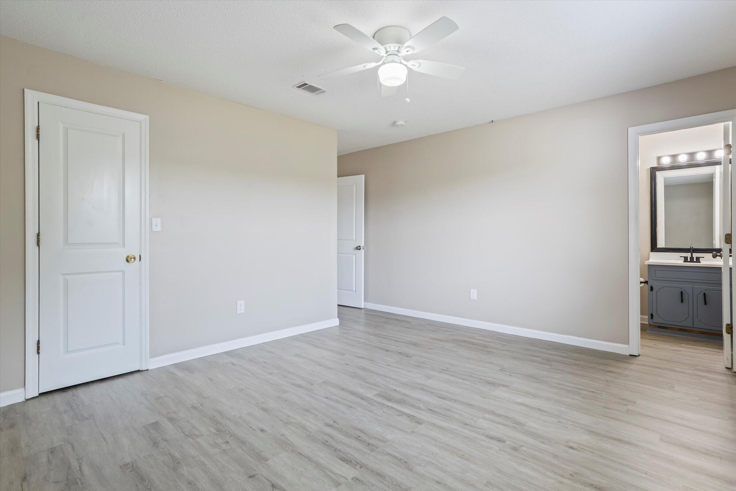 305 Manchester Court Grovetown, GA 30813 - Photo 6 of 13 wooden floor in an empty room with a window