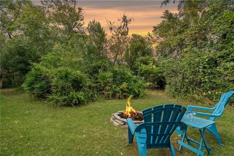 a view of chair and table in the garden