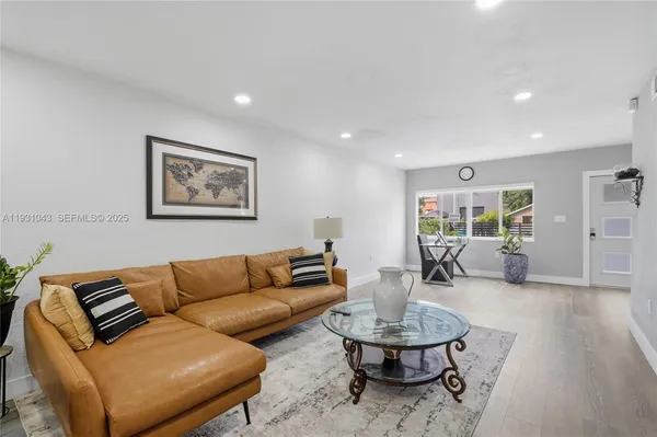 a living room with furniture and a table