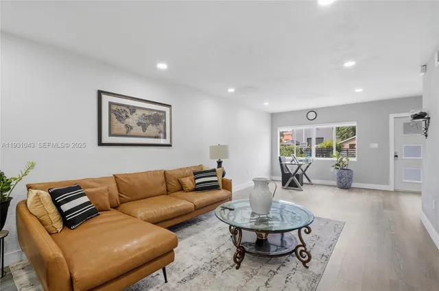 a living room with furniture and a table