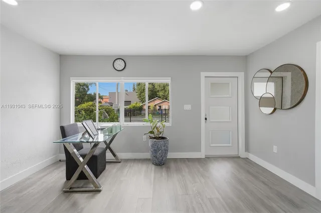 a work room with furniture and wooden floor