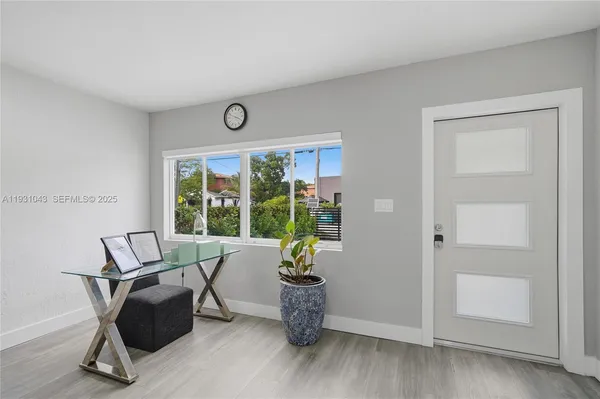 a work room with furniture and windows