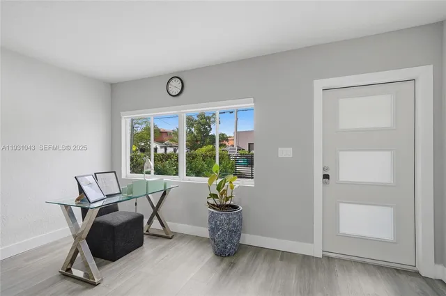 a work room with furniture and windows