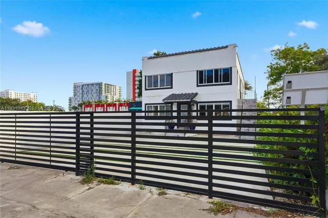 a front view of a building with glass windows